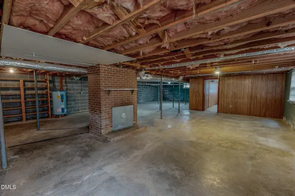 a view of empty room with wooden walls