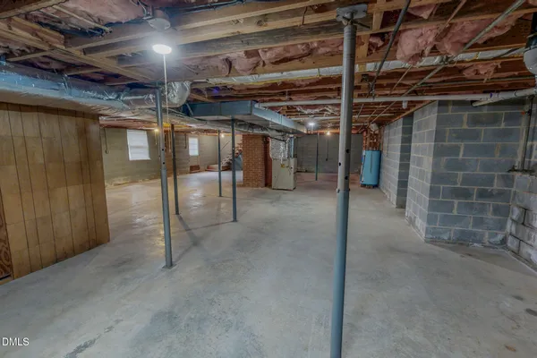 a view of a room with wooden floor and windows