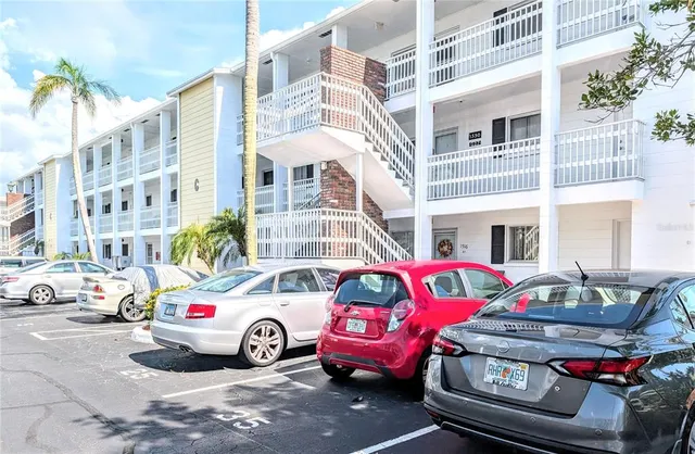 a car parked in front of a buildings