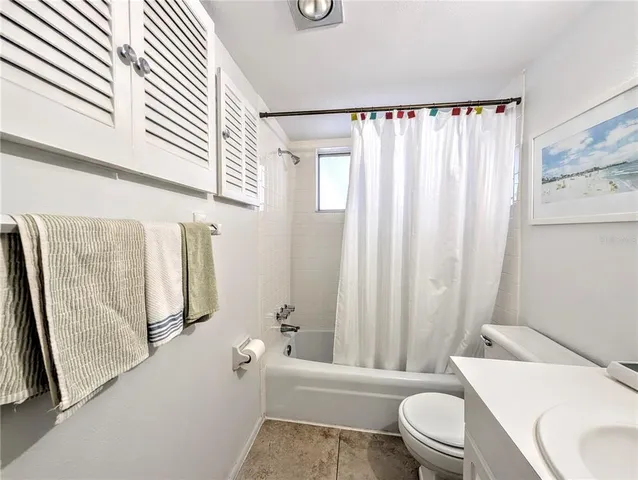 a bathroom with a toilet and a bathtub