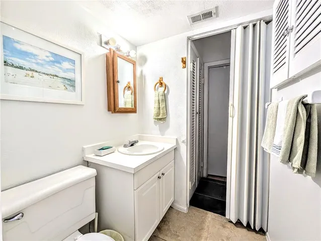 a bathroom with a double vanity sink mirror and