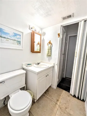 a bathroom with a sink toilet and vanity