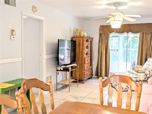 a bedroom with furniture and a flat screen tv