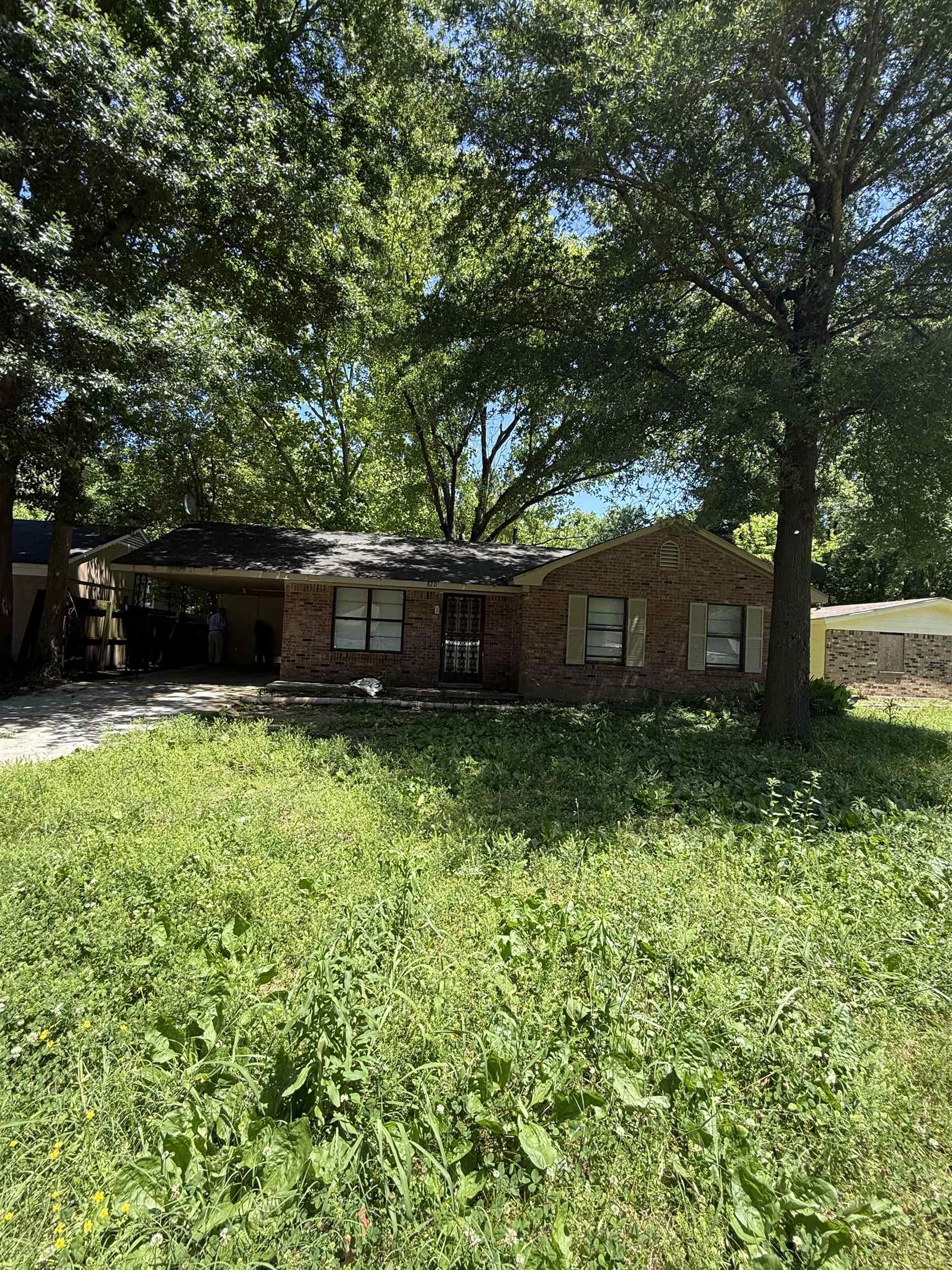 820 Archie Drive Memphis, TN 38127 - Photo 2 of 11 a view of a backyard with a garden
