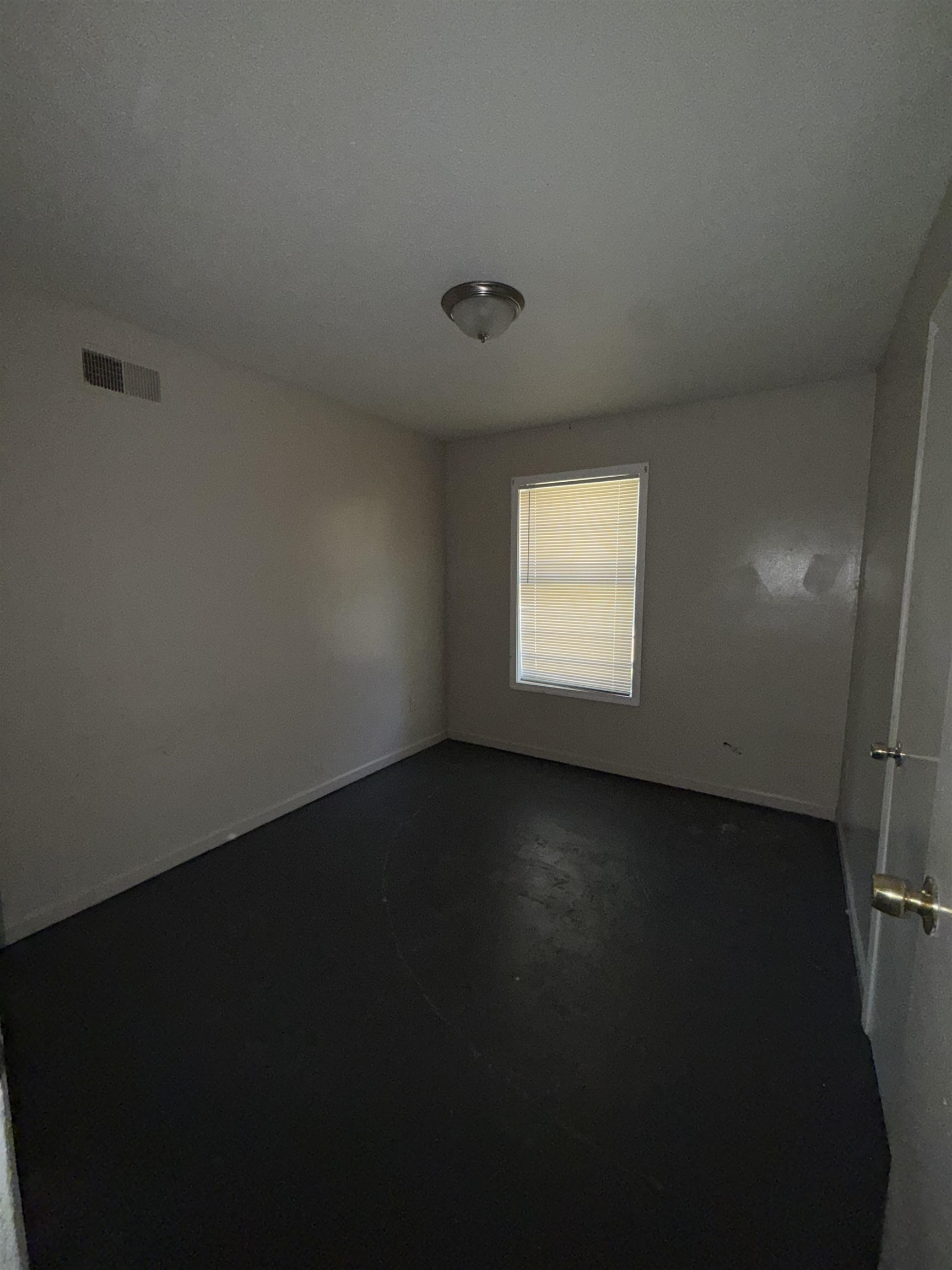 820 Archie Drive Memphis, TN 38127 - Photo 6 of 11 a view of an empty room with wooden floor and a window