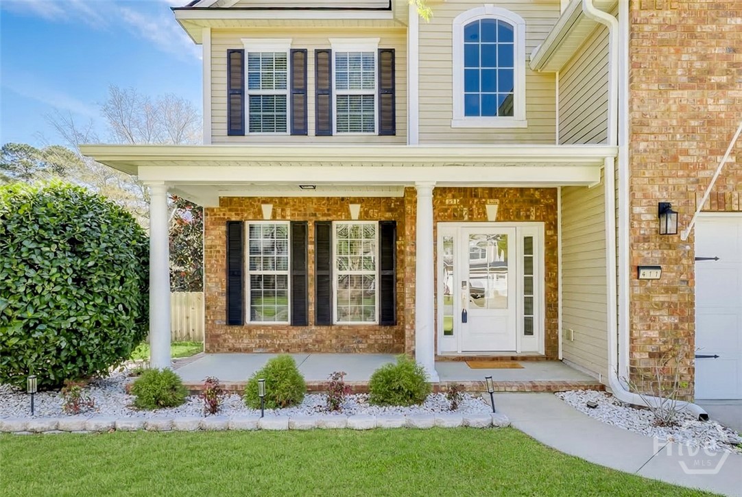 411 Plantation Place Rincon, GA 31326 - Photo 2 of 38 Front porch perfect for rockers.