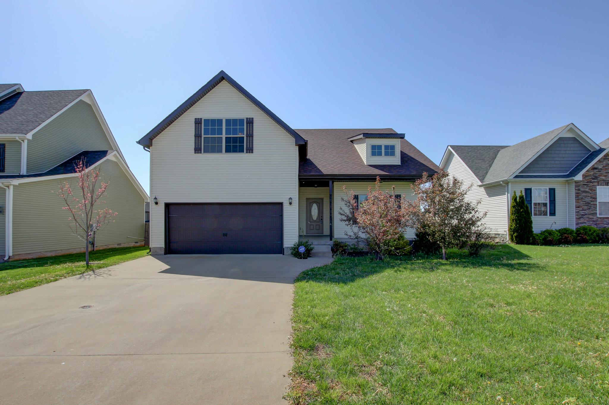 3736 Suiter Road Clarksville, TN 37040 - Photo 16 of 21 a front view of a house with a yard and garage