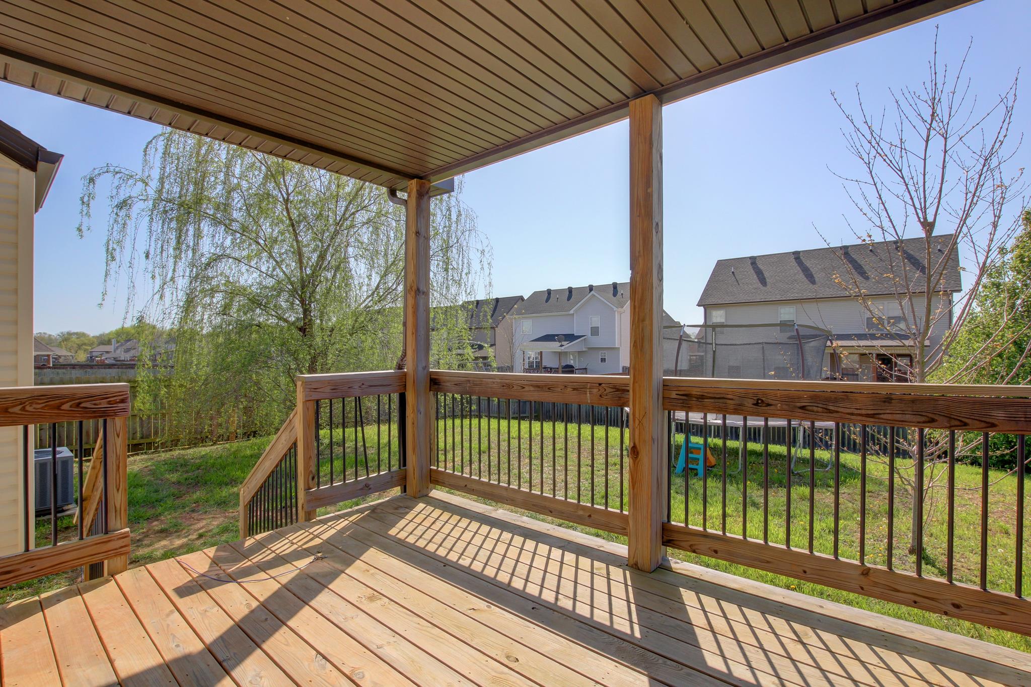 3736 Suiter Road Clarksville, TN 37040 - Photo 18 of 21 a view of a porch with wooden floor next to a yard