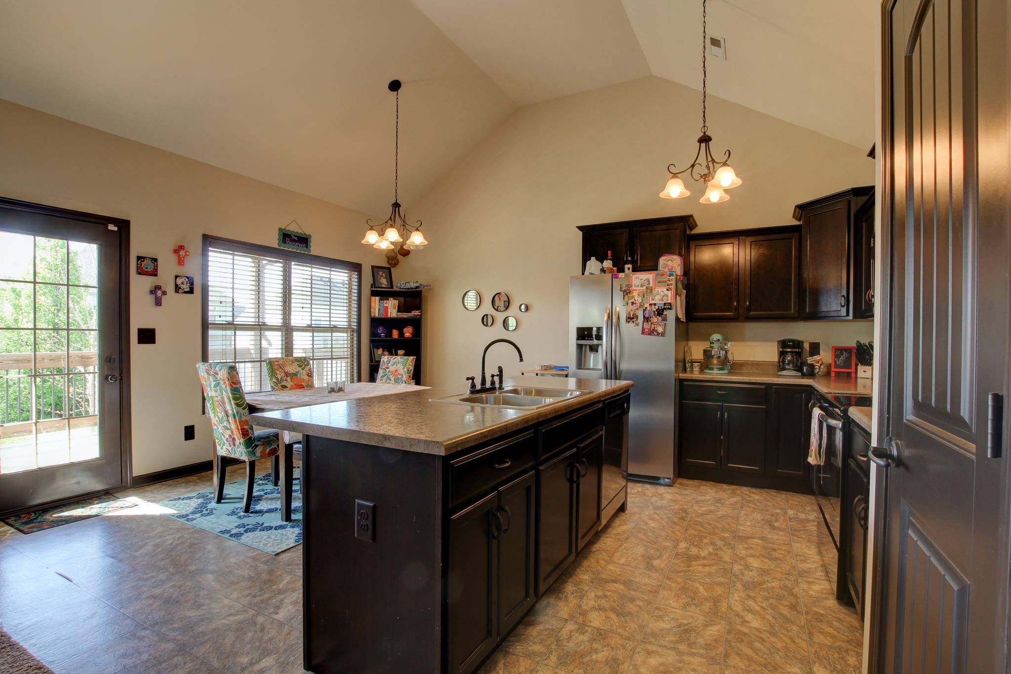 3736 Suiter Road Clarksville, TN 37040 - Photo 7 of 21 a kitchen with stainless steel appliances granite countertop a sink a stove and a refrigerator
