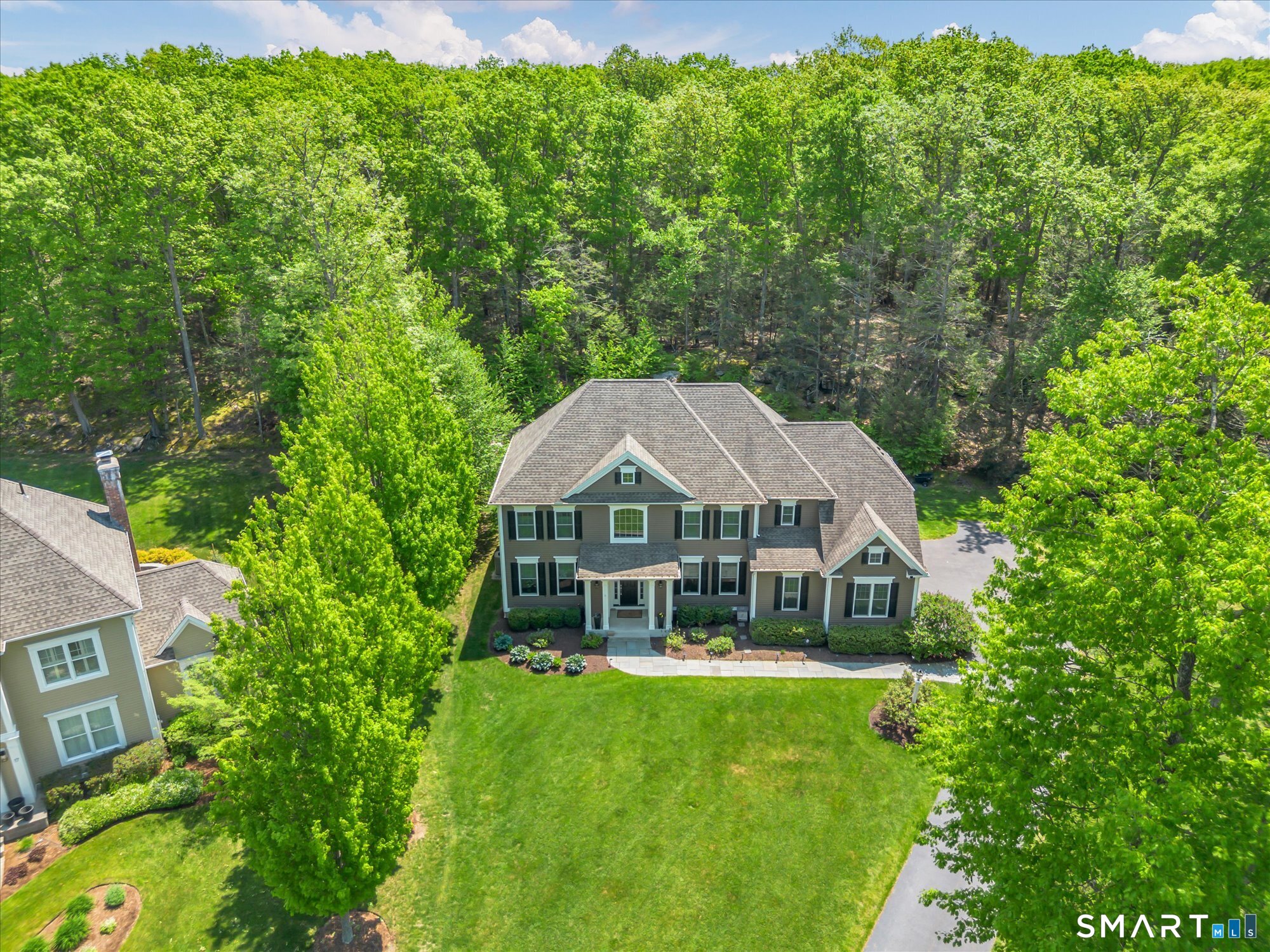 16 Sweetheart Mountain Road Canton, CT 06019 - Photo 3 of 40 a front view of a house with a garden
