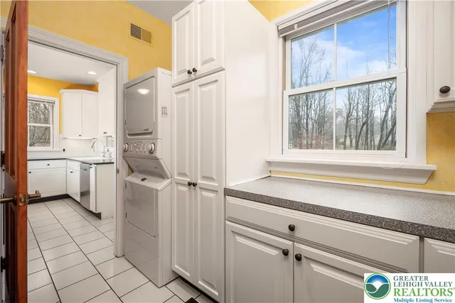 a bathroom with a shower a sink a toilet and a mirror