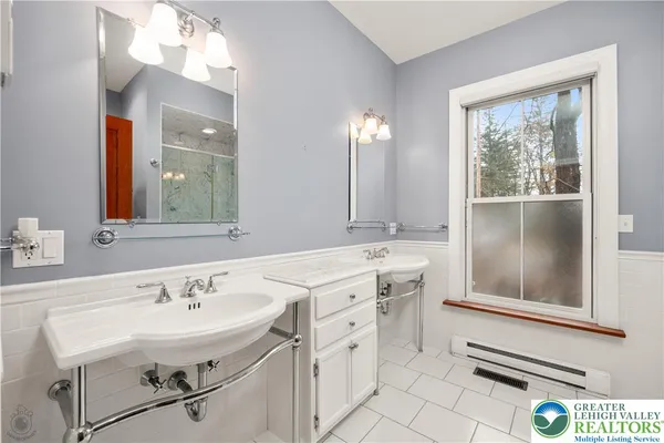 a bathroom with a glass shower door