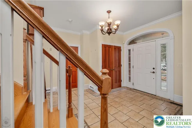 a living room with a rug dresser and a window