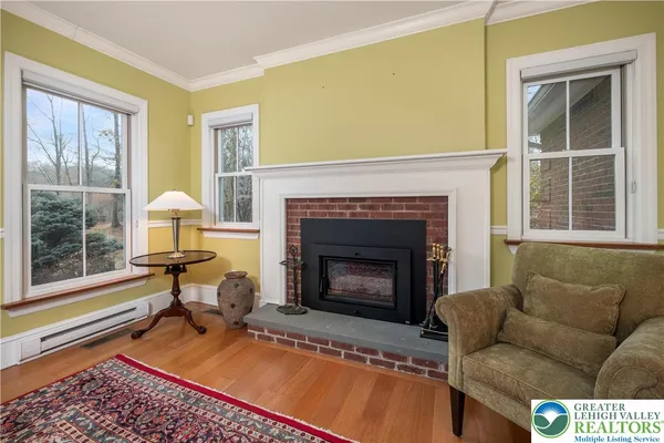 a room that has a dresser and a chair next to it