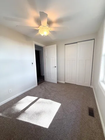 an empty room with a bathroom