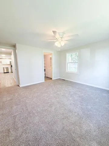 a view of an empty room with a window