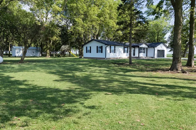 a fire hydrant in the middle of a field