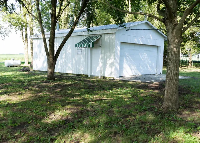 a view of a house with a tree
