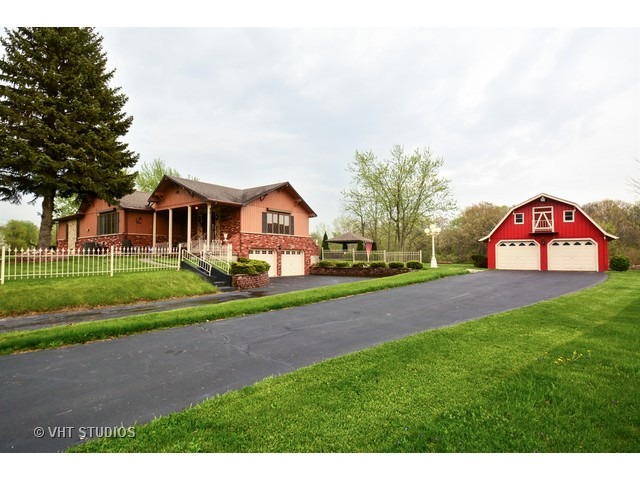 3239 East Bemes Road Crete, IL 60417 - Photo 1 of 10 a front view of a house with garden