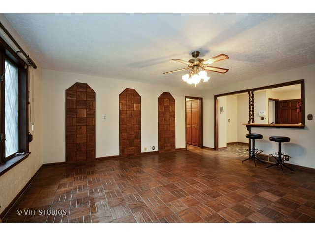 3239 East Bemes Road Crete, IL 60417 - Photo 4 of 10 a view of an empty room with window and a ceiling fan