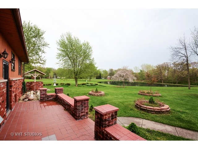 3239 East Bemes Road Crete, IL 60417 - Photo 7 of 10 a view of a table and chairs in the garden