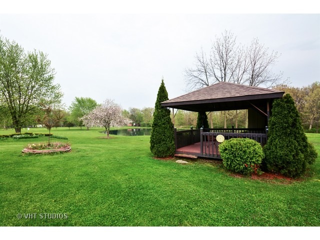 3239 East Bemes Road Crete, IL 60417 - Photo 8 of 10 a view of a garden with a fountain