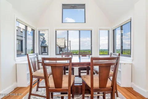 a view of a dining room with furniture window and outside view