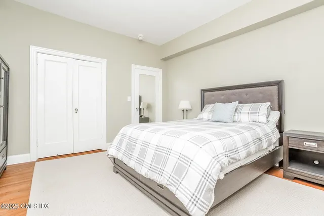 a bedroom with a bed and window