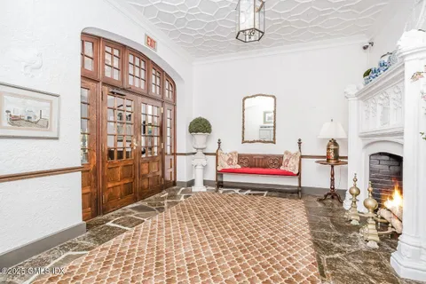 a bedroom with furniture and a fireplace