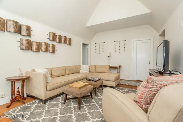 a hallway with a stove top oven a washer and dryer