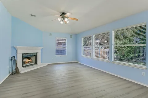 a view of a kitchen with a sink and a window
