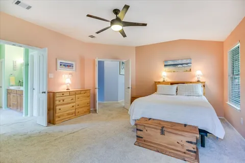 a bathroom with a granite countertop sink a mirror and shower