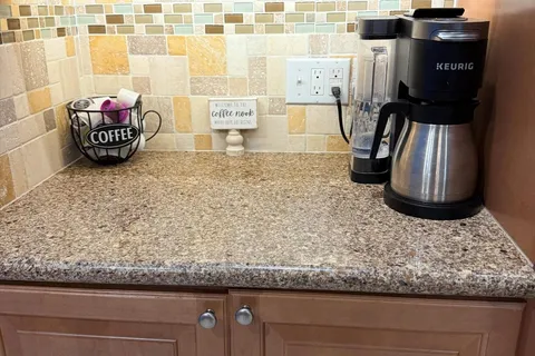 a kitchen with stainless steel appliances a refrigerator and microwave
