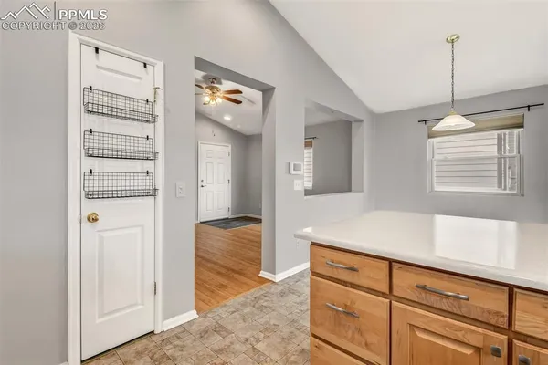 a view of hallway with sink and mirror