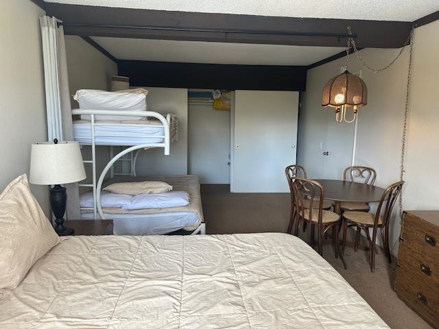 248 Mammoth Slopes, Unit F53 Mammoth Lakes, CA 93546 - Photo 21 of 35 a bedroom with a bed and a chair