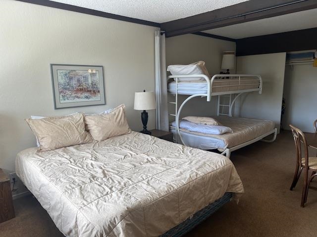 248 Mammoth Slopes, Unit F53 Mammoth Lakes, CA 93546 - Photo 22 of 35 a bedroom with bed and window