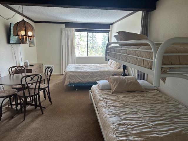 248 Mammoth Slopes, Unit F53 Mammoth Lakes, CA 93546 - Photo 24 of 35 a bedroom with a bed and wooden floor