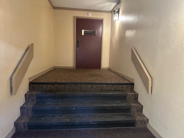 248 Mammoth Slopes, Unit F53 Mammoth Lakes, CA 93546 - Photo 25 of 35 a view of staircase with white walls and railing
