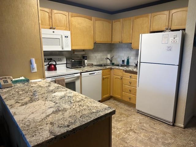 248 Mammoth Slopes, Unit F53 Mammoth Lakes, CA 93546 - Photo 6 of 35 a kitchen with stainless steel appliances granite countertop a refrigerator sink stove and microwave