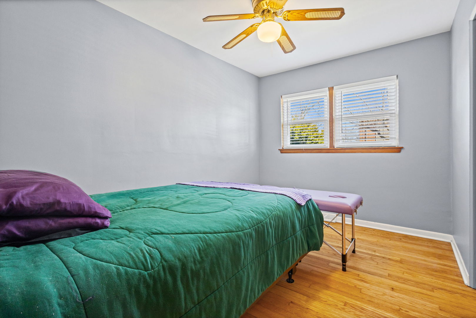 5901 108th Place Chicago Ridge, IL 60415 - Photo 13 of 15 a bedroom with a bed and a chandelier