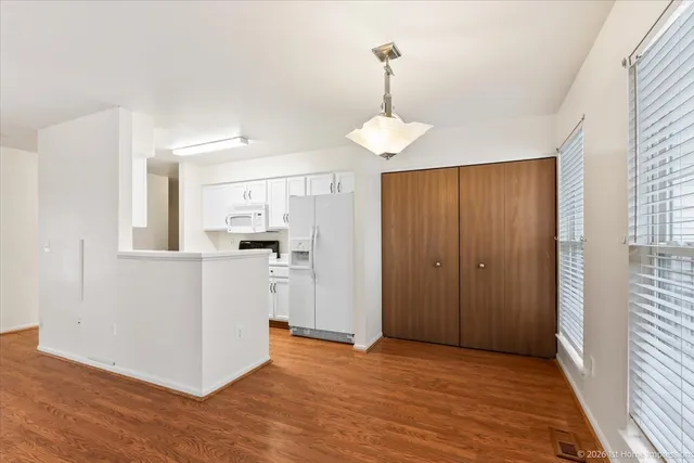 a view of a kitchen from the hallway