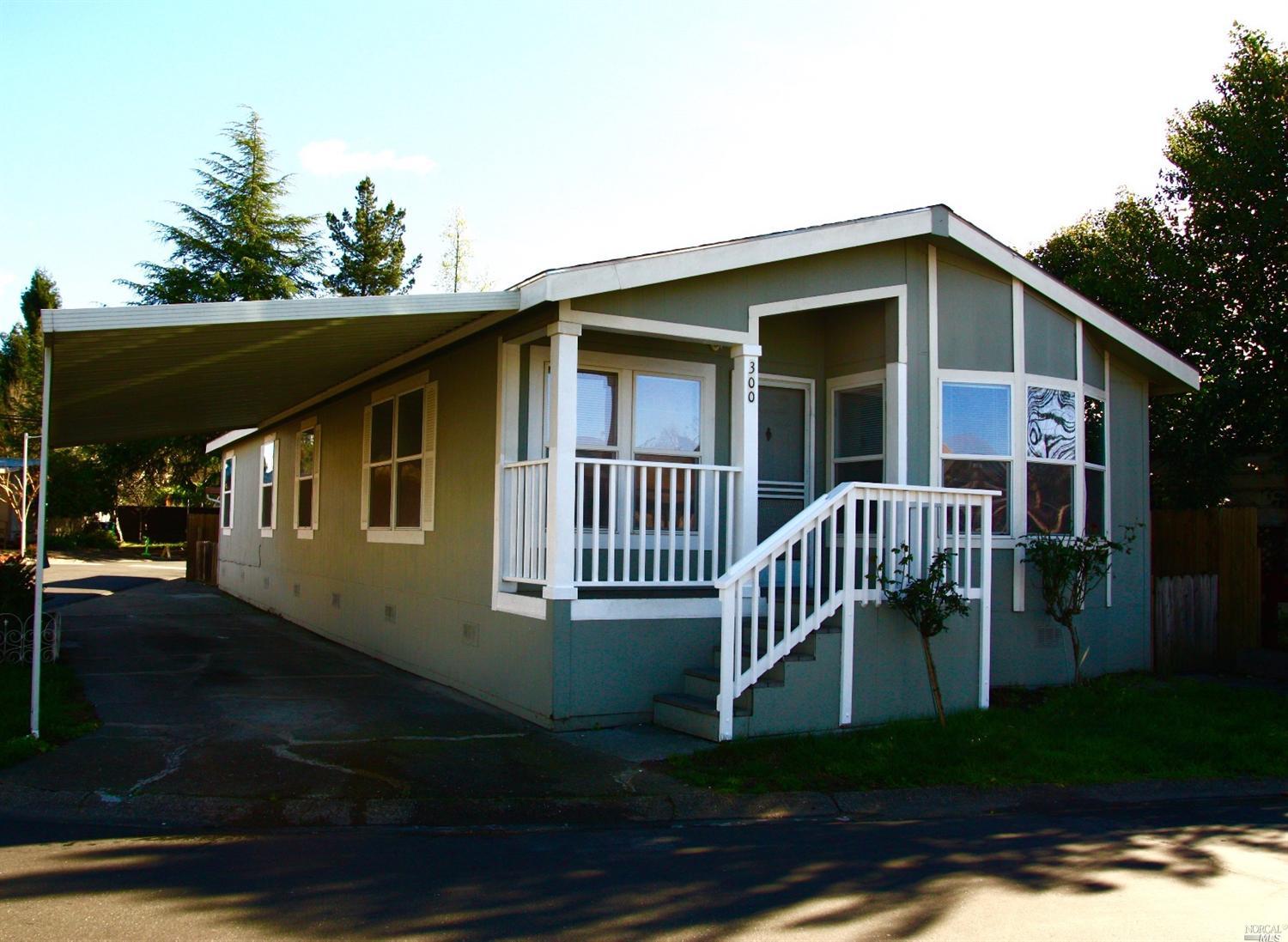 300 Candy Lane, Unit 300 Santa Rosa, CA 95403 - Photo 1 of 1 Welcoming home in All Age Redwood Village. Note the corner lot and the drive through parking arrangement.