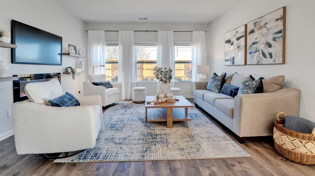 a dining room with furniture and wooden floor