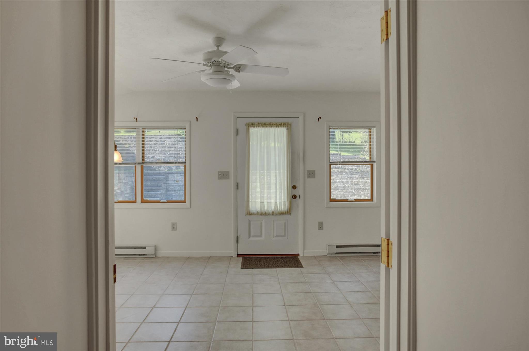 120 North Winding Road Wellsville, PA 17365 - Photo 27 of 66 Sunroom leading to back courtyard