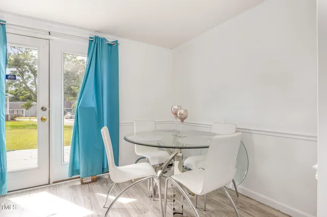 a view of a room that has a table and chair