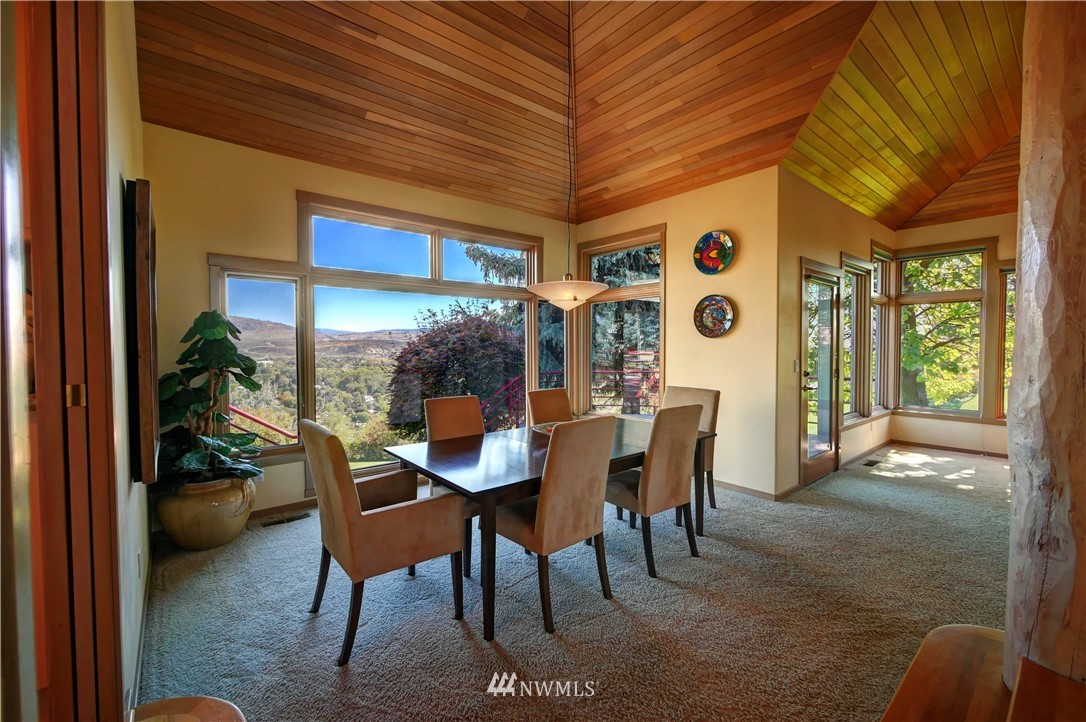 25 Black Road Omak, WA 98841 - Photo 11 of 38 a dining room with furniture and a floor to ceiling window