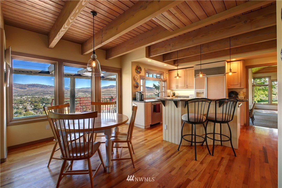 25 Black Road Omak, WA 98841 - Photo 15 of 38 a dining room with furniture window wooden floor