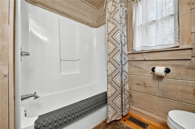 100 Arrow Way Mineral Bluff, GA 30559 - Photo 26 of 53 a bathroom with a bathtub and shower