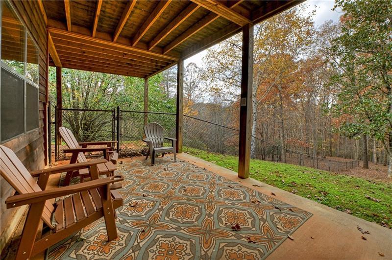 100 Arrow Way Mineral Bluff, GA 30559 - Photo 42 of 53 a view of a patio with a table chairs and a backyard