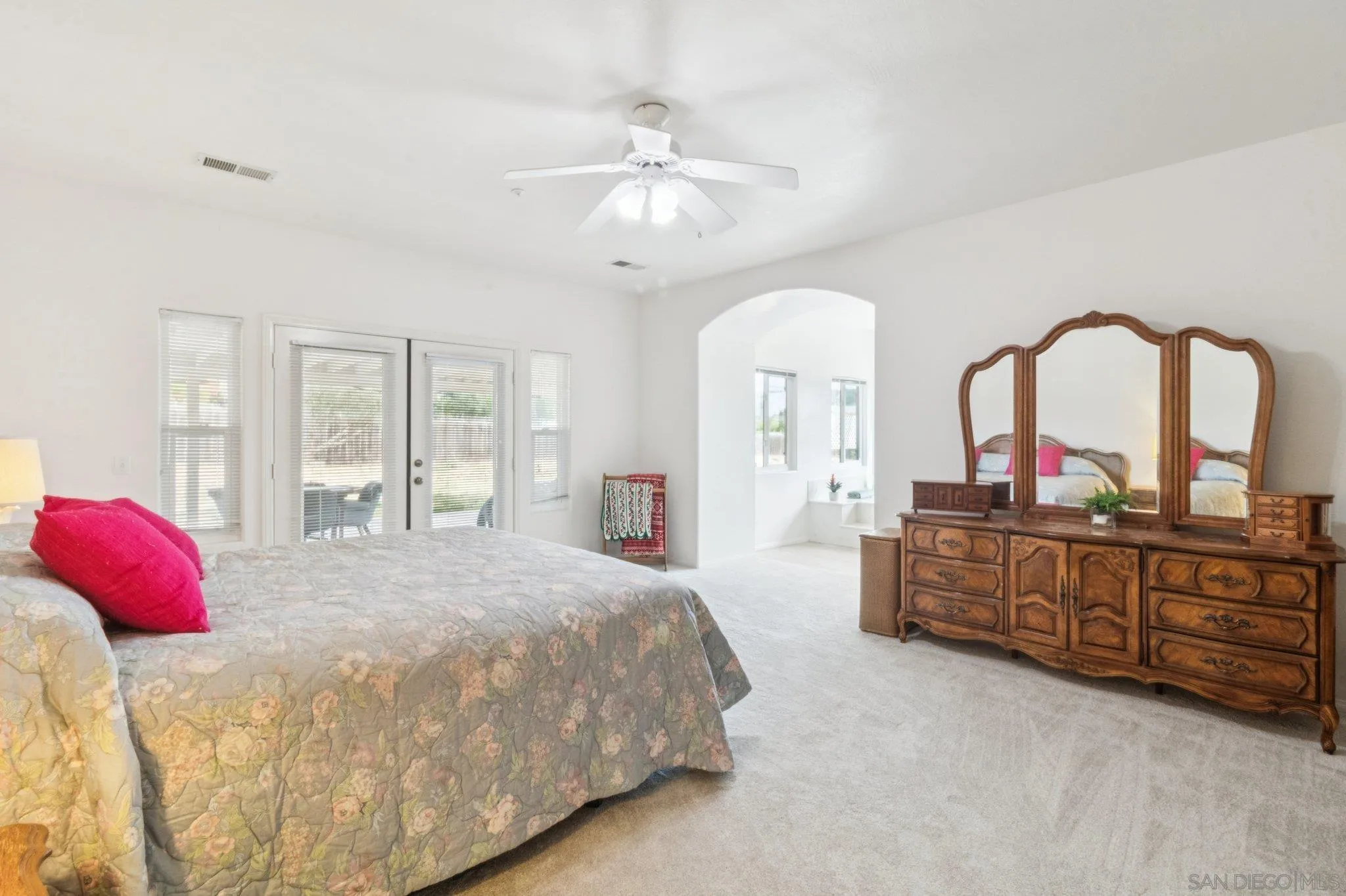 1346 Wilson Road Ramona, CA 92065 - Photo 37 of 71 This primary suite is the ultimate, spacious, French doors towards the back patio, its own private tub, double sinks, large walking shower, and walking closet. This is home with large bedrooms in Ramona